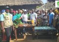 Hawa Bockarie (In WHH Field Gear from left), WHH Field Staff and project participants in Njaluahun Community in preparation for the Cooking Class.