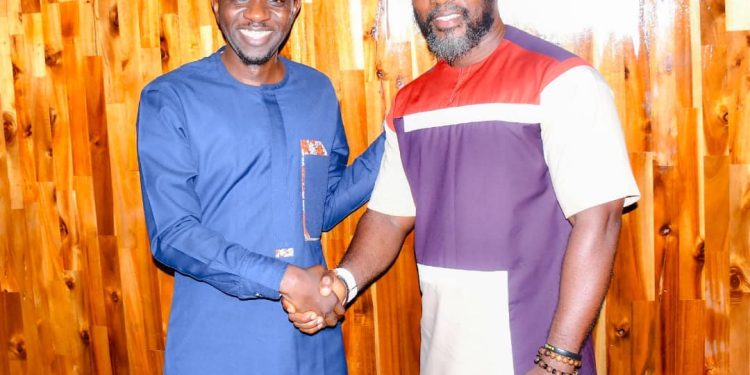 IMC HOSTS COMMS MINISTER