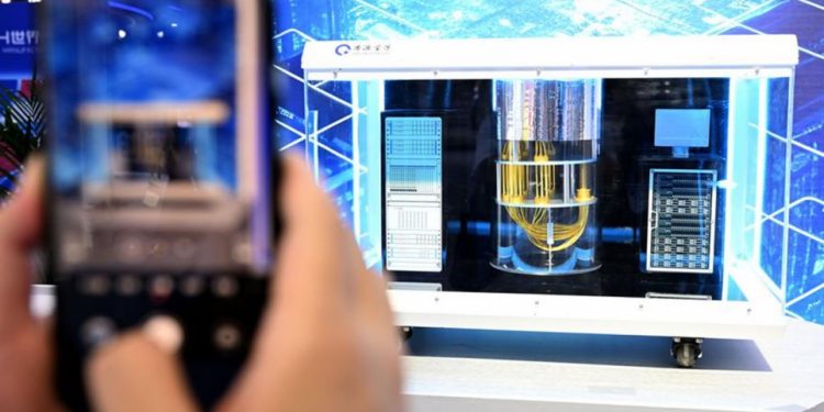 A visitor takes photos of an Origin Wukong superconducting quantum computer model at the 2024 World Manufacturing Convention in Hefei, East China's Anhui Province on September 20, 2024. Photo: Xinhua